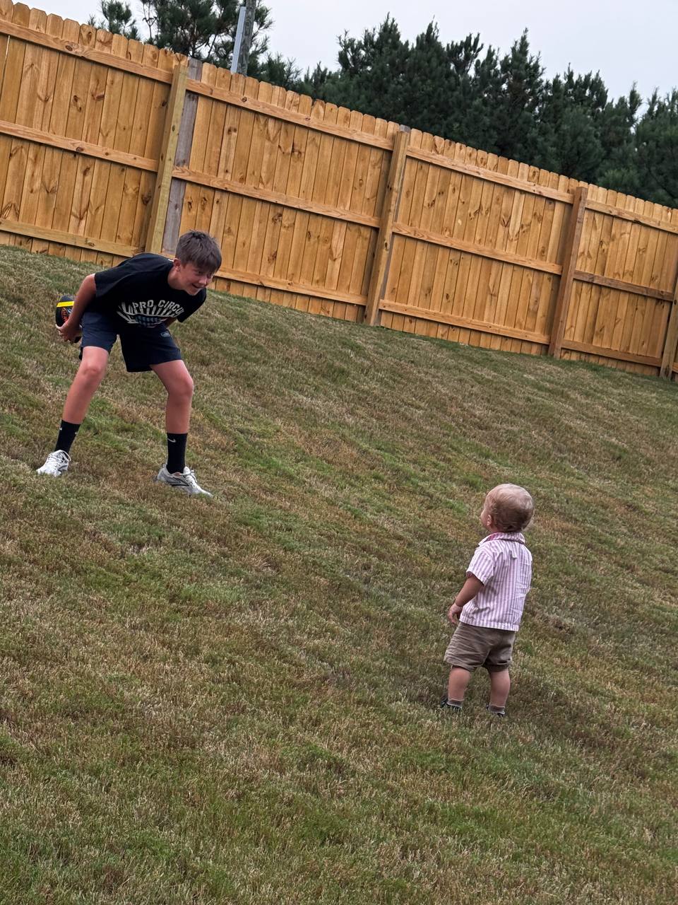 Barrett and baby in the Bessemer backyard